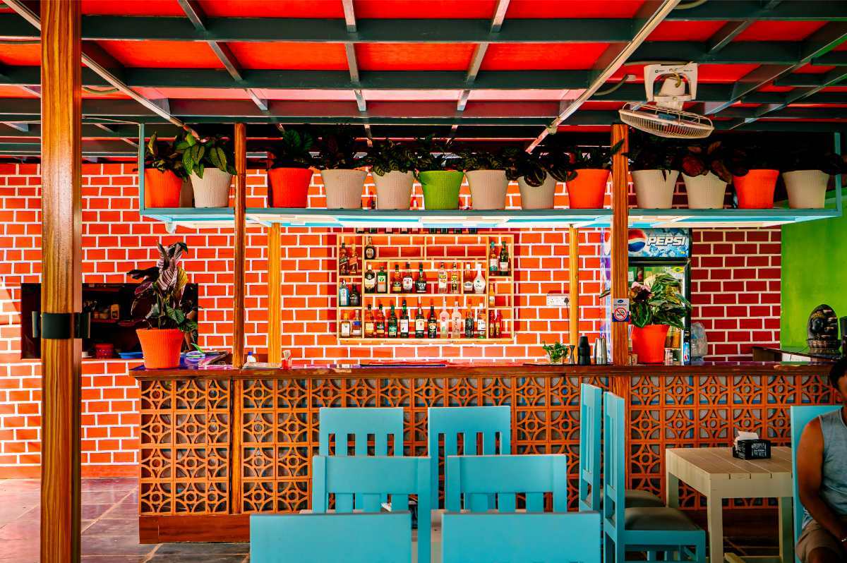 Beach resort in South Goa with open-air restaurant and sea view.