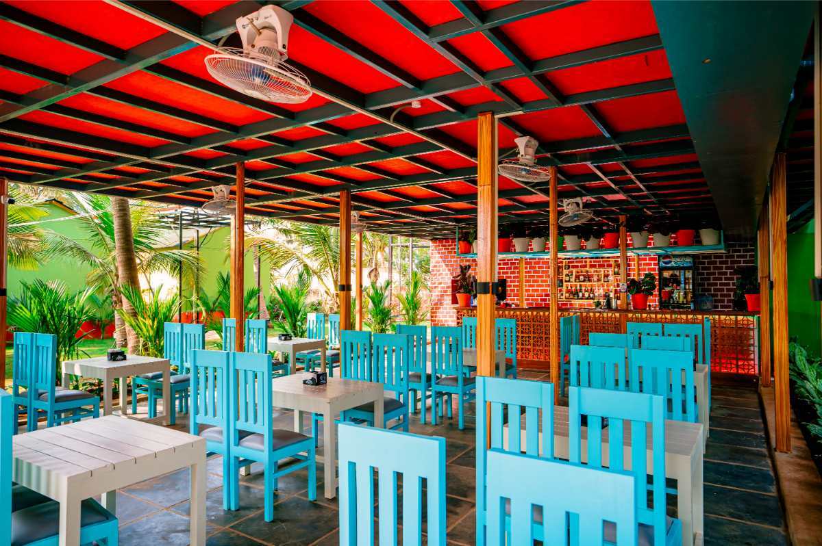 Luxury resort in South Goa featuring restaurant and bar near the beach.