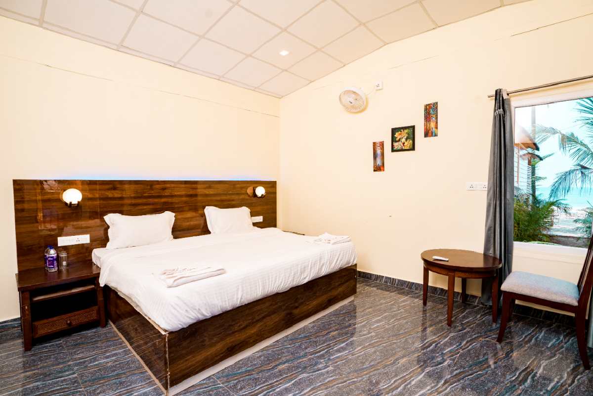 Bright and airy garden view room at Orange Sky Beach Resort.